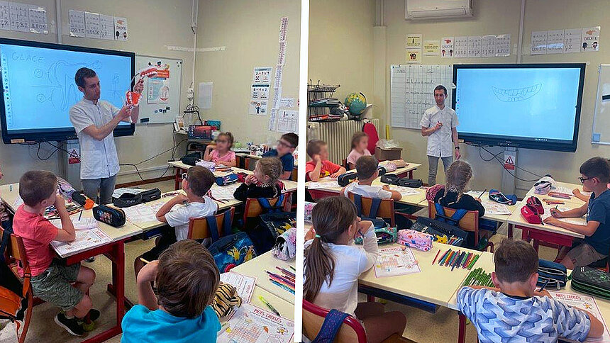 Le Dr Maxime Faltot parle devant des élèves d'une classe de primaire.
